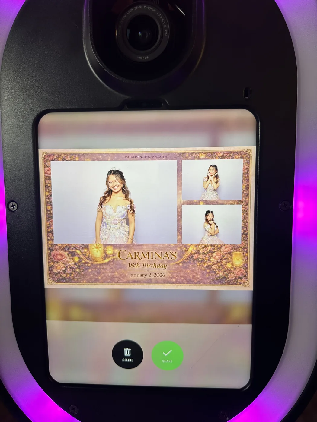 A finished photo showing on the booth screen under party lighting