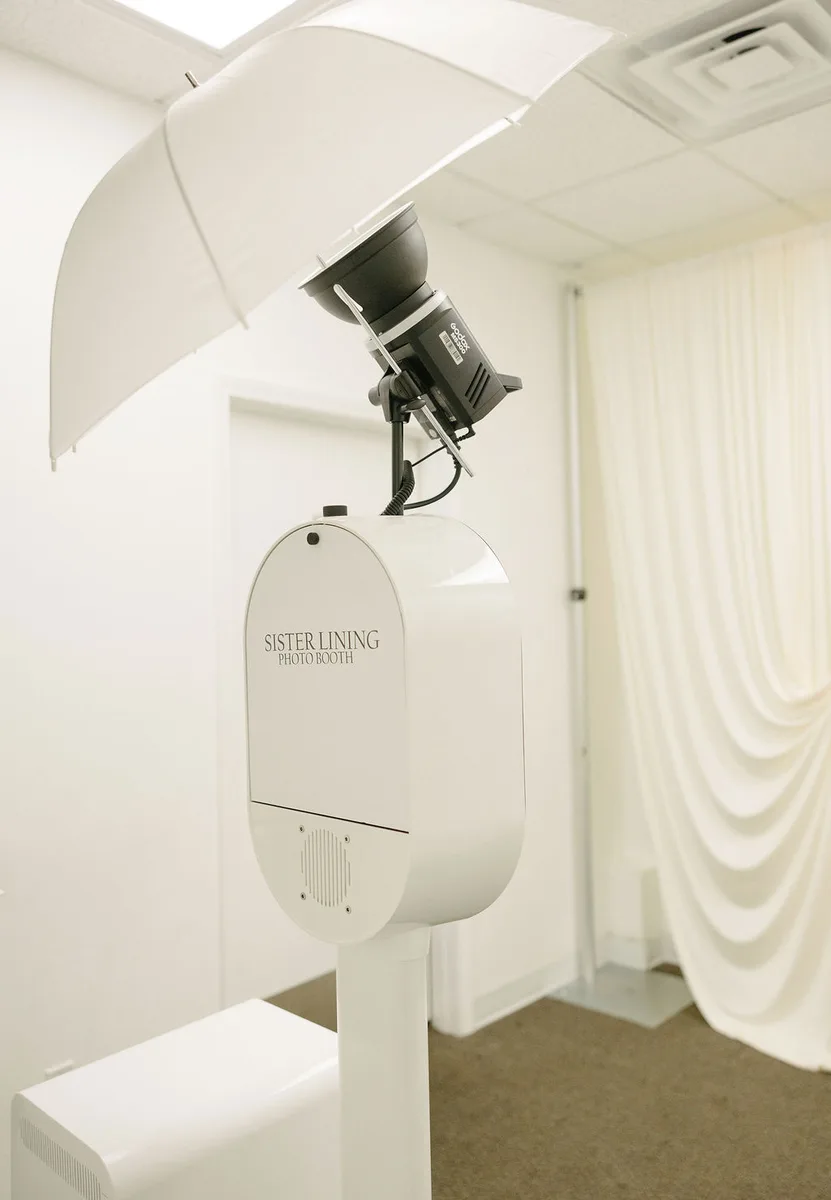 The booth standing ready against a draped backdrop in an empty room