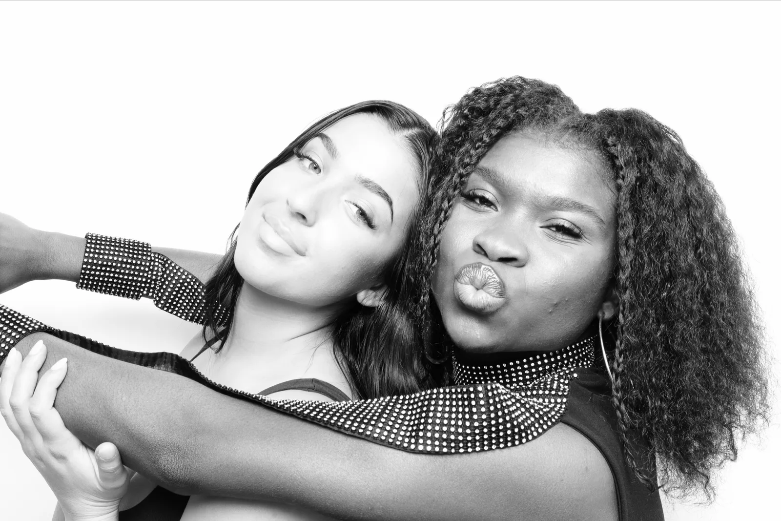 Two guests photographed in black and white in the booth